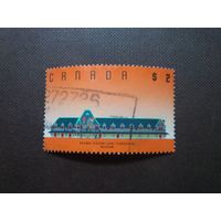 Канада 1989 г.Железнодорожная станция Макэдэма, Нью-Брансуик.Номинал 2 доллара.